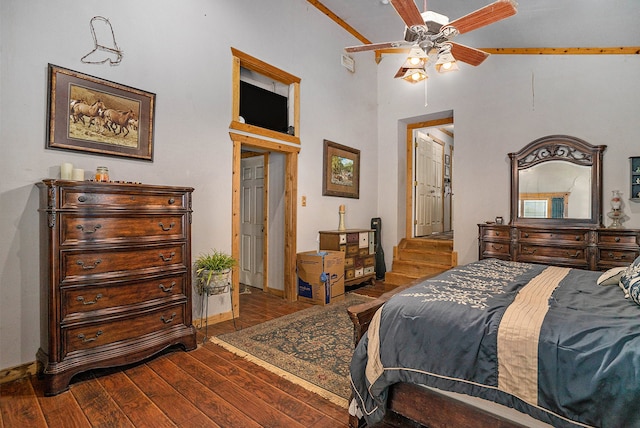 bedroom with vaulted ceiling, dark hardwood / wood-style floors, and ceiling fan