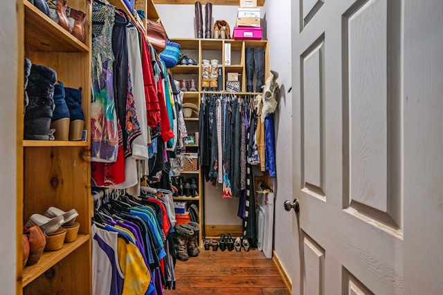 spacious closet featuring hardwood / wood-style floors