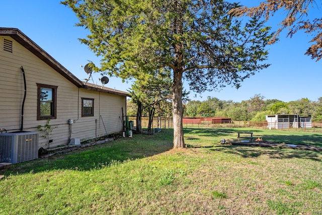 view of yard with central AC