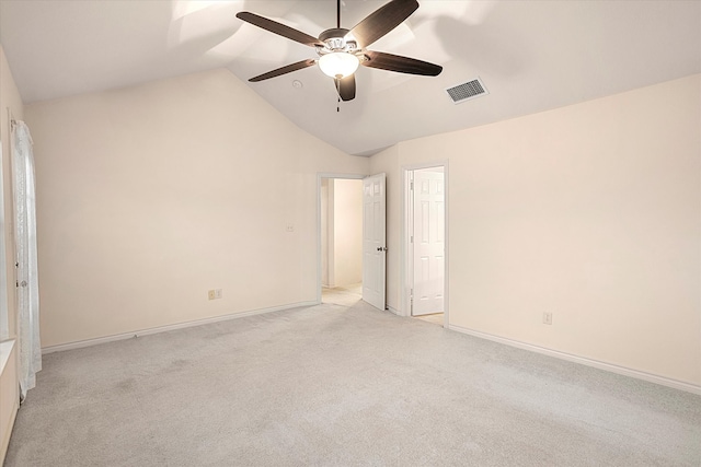 unfurnished bedroom with lofted ceiling, light colored carpet, and ceiling fan