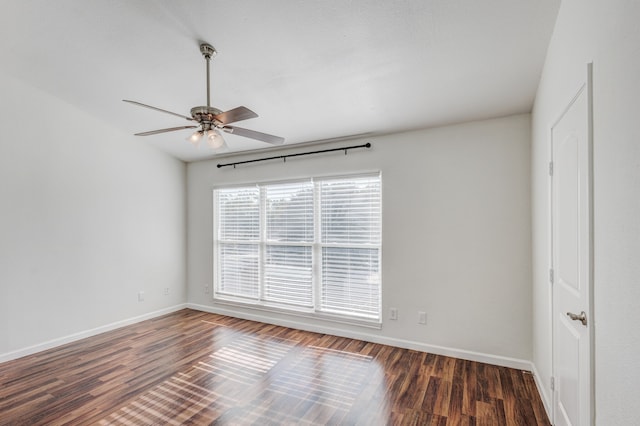 unfurnished room featuring ceiling fan and dark hardwood / wood-style flooring