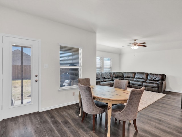 dining room with ceiling fan and dark hardwood / wood-style flooring