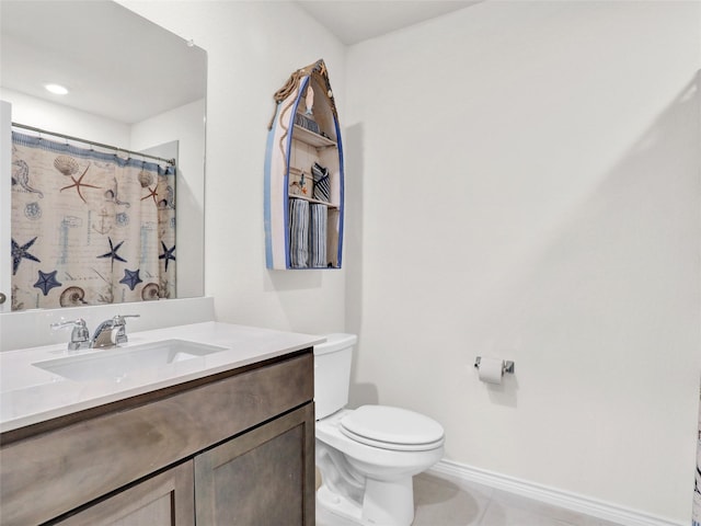 bathroom with vanity, tile patterned floors, and toilet