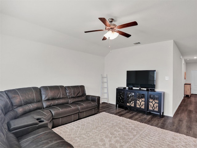 living room with dark hardwood / wood-style flooring and ceiling fan