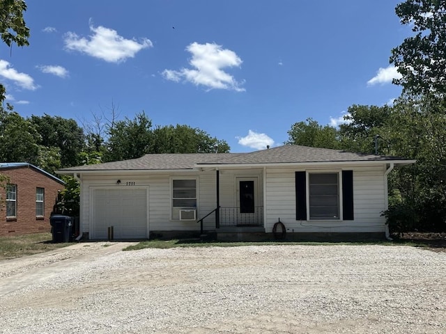 single story home featuring a garage