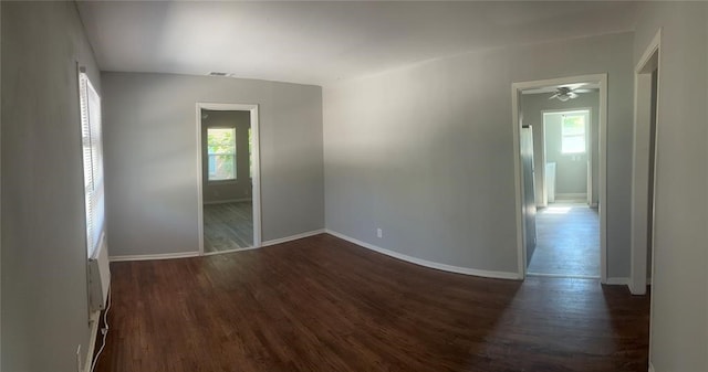 empty room featuring dark hardwood / wood-style floors and ceiling fan