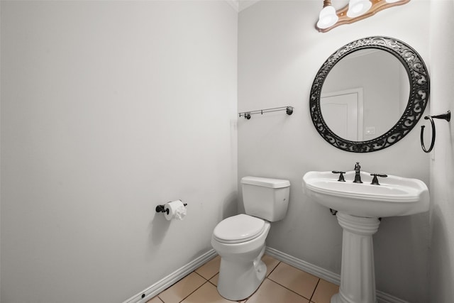 bathroom with tile patterned flooring and toilet