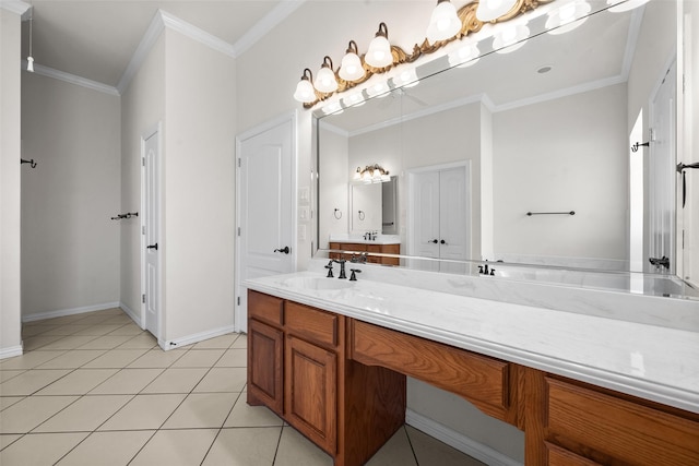 bathroom with crown molding, tile patterned flooring, and vanity