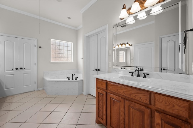 bathroom with vanity, a tub to relax in, tile patterned floors, and crown molding