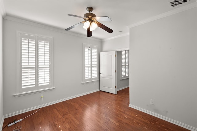 empty room with ceiling fan, wood-type flooring, and ornamental molding