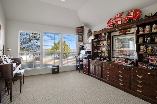 interior space with lofted ceiling and ceiling fan