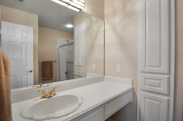 bathroom with vanity and walk in shower