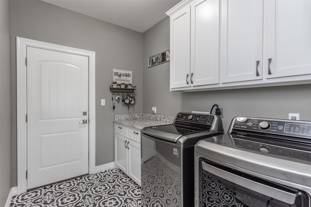 laundry area with cabinets and independent washer and dryer