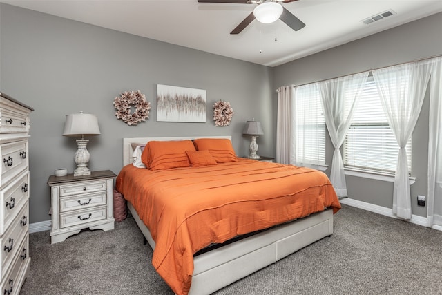 bedroom with dark carpet and ceiling fan