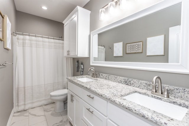 bathroom with vanity, toilet, and walk in shower