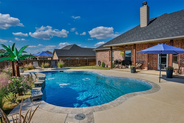 view of swimming pool featuring a patio area and pool water feature