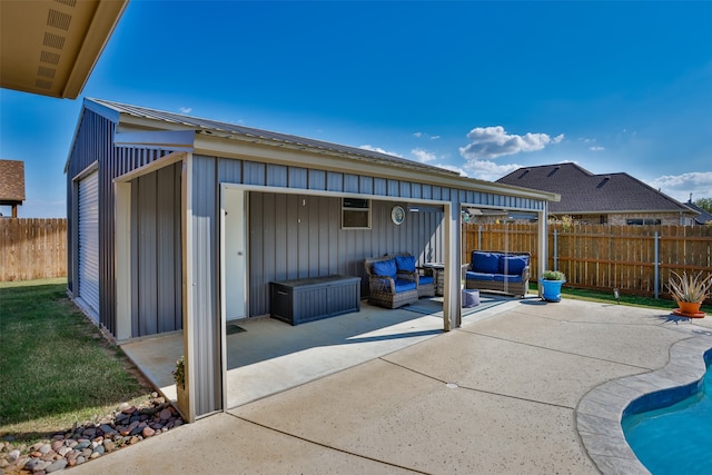 view of patio featuring a fenced in pool and an outdoor living space