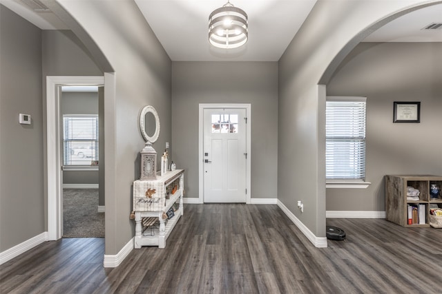 entrance foyer with dark hardwood / wood-style floors