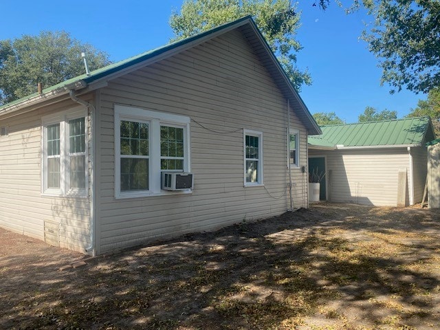 view of side of home with cooling unit