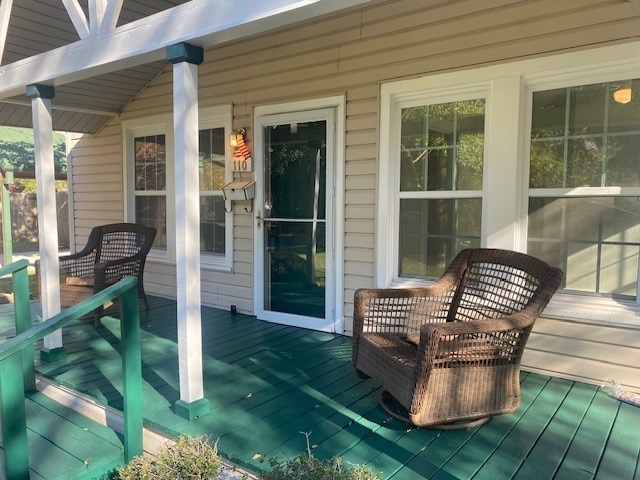 wooden deck featuring covered porch