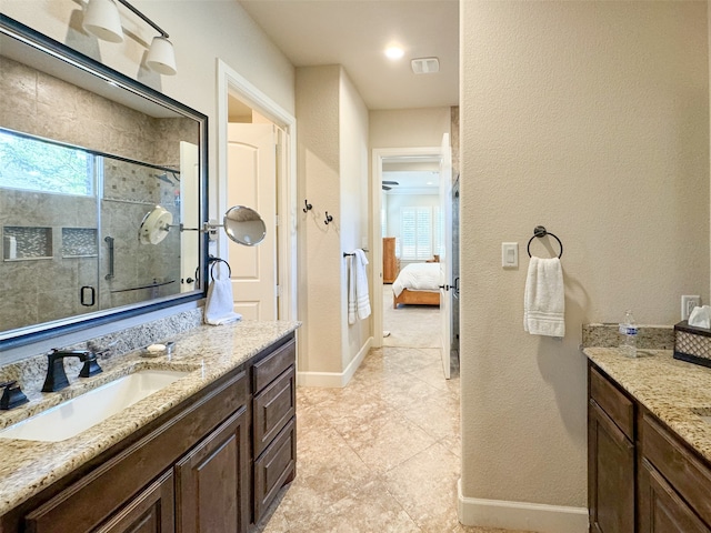 bathroom featuring vanity, walk in shower, and tile patterned floors