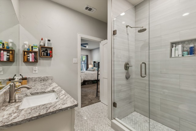 bathroom featuring vanity, walk in shower, and tile patterned floors