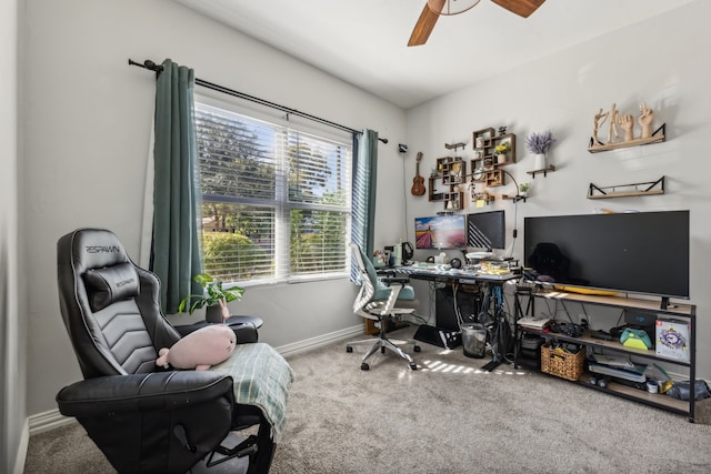 carpeted office space with ceiling fan