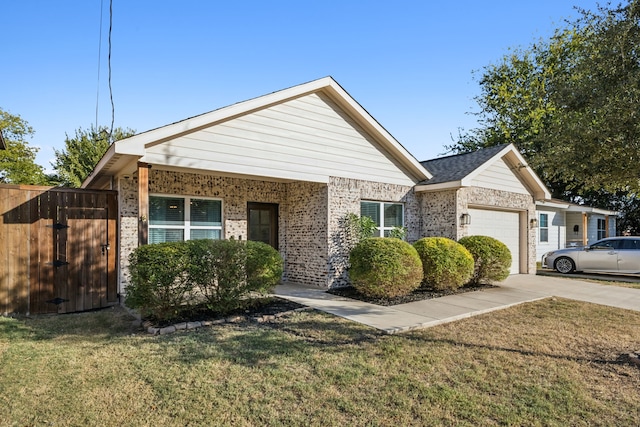 single story home with a front lawn and a garage