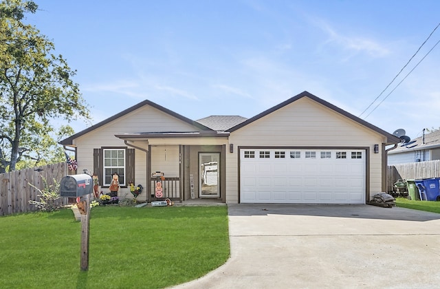 single story home with covered porch, a garage, and a front yard