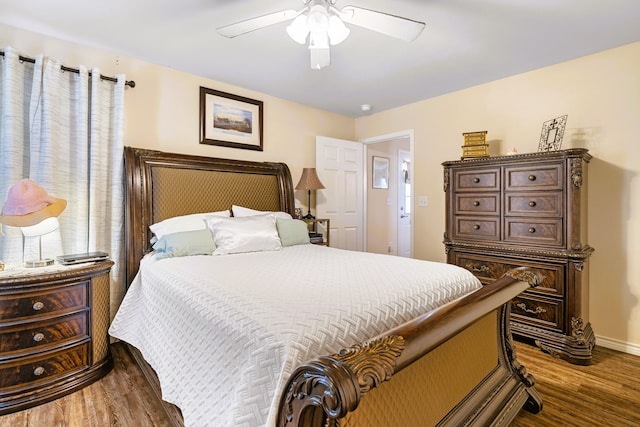 bedroom featuring hardwood / wood-style flooring and ceiling fan