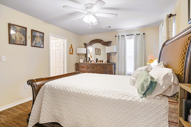 bedroom with ceiling fan and hardwood / wood-style flooring