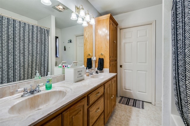 bathroom with vanity and curtained shower