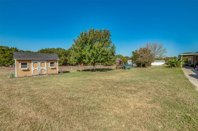 view of yard featuring a shed and a playground