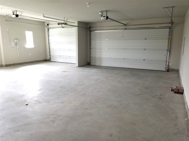 garage featuring a garage door opener