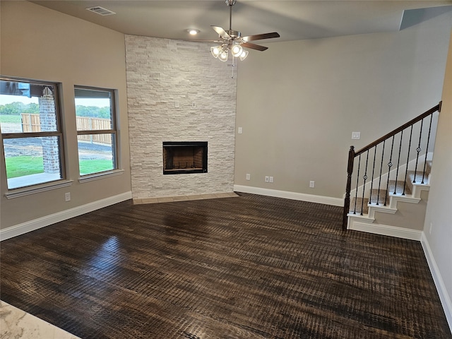 unfurnished living room with ceiling fan and a fireplace