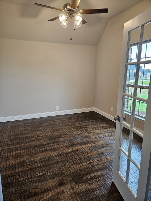 unfurnished room with vaulted ceiling