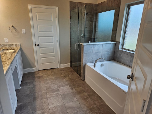2508 Silo Ln, Van Alstyne, TX 75495 - full bathroom featuring a stall shower, a garden tub, vanity, and baseboards