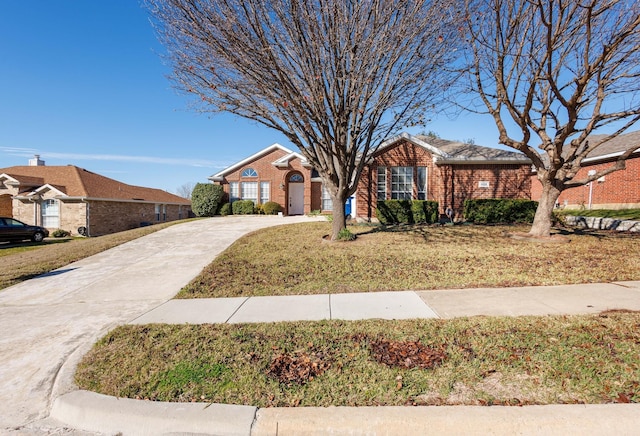 ranch-style home featuring a front yard