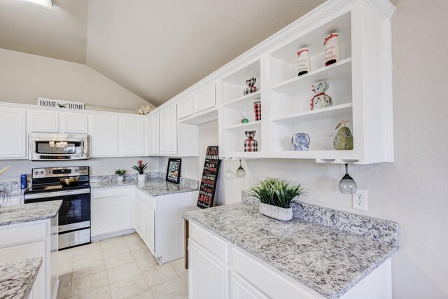 kitchen with white cabinetry, light stone countertops, and stainless steel appliances