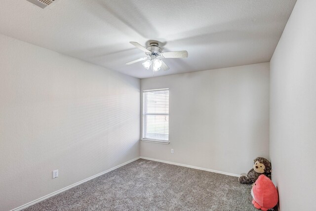 unfurnished room featuring light colored carpet and ceiling fan