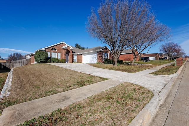 single story home with a garage and a front lawn