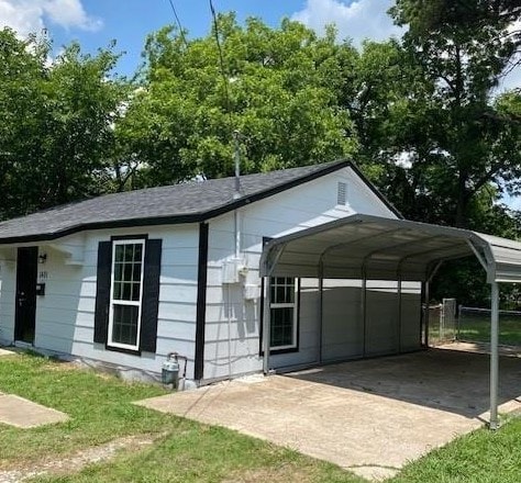 exterior space with a carport