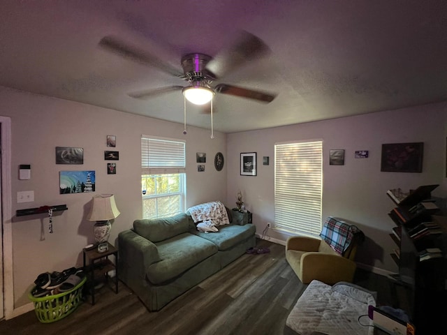 living room with dark hardwood / wood-style floors and ceiling fan