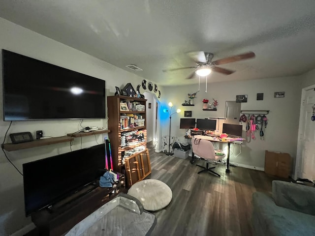 interior space with hardwood / wood-style flooring, a textured ceiling, and ceiling fan