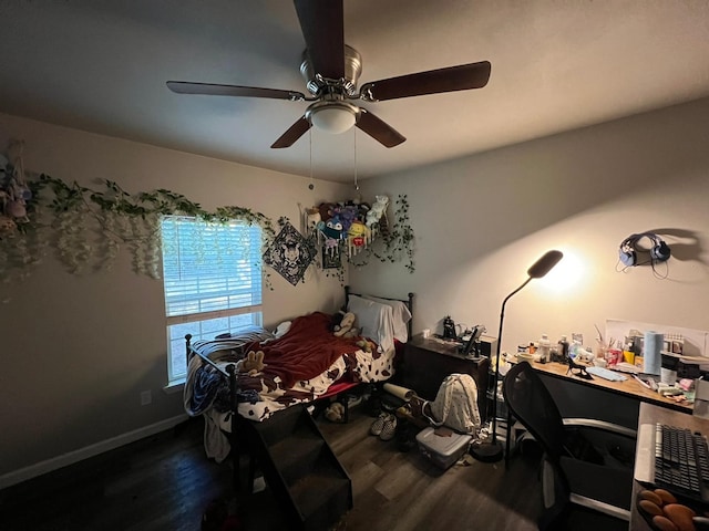 bedroom with ceiling fan and dark hardwood / wood-style floors