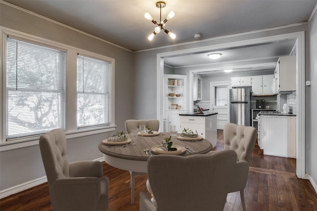 dining area with dark hardwood / wood-style flooring and crown molding