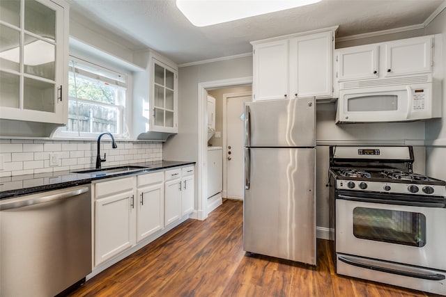 kitchen with sink, stainless steel appliances, dark hardwood / wood-style flooring, backsplash, and white cabinets