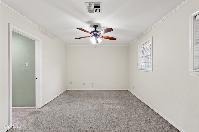 empty room with crown molding, ceiling fan, and light carpet