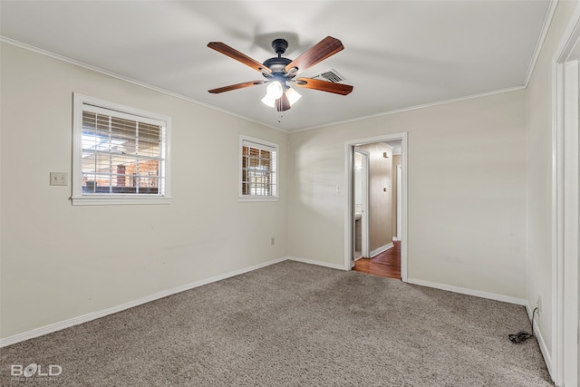 carpeted empty room featuring ceiling fan and ornamental molding