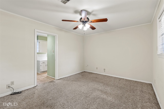 unfurnished bedroom featuring light carpet, ensuite bath, ceiling fan, and ornamental molding